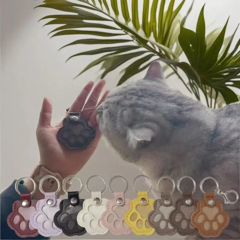 Llavero portátil multifuncional con diseño de huella de gato, fabricado en cuero, con compartimento para guardar pelo o recuerdos de mascotas.